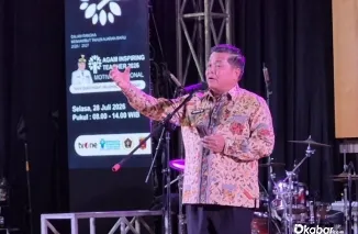 Bupati Agam Benni Warlis saat memberikan sambutan sekaligus membuka kegiatan Agam Inspiring Teacher 2026 di Auditorium Student Centre UIN Sjech M. Djamil Djambek, Selasa (28/7/2026). (Foto: Ist)